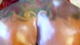 Oiled Tattooed Shemale Deepthroats Cock in Front of Christmas Tree