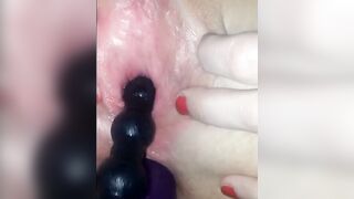 Amateur Girl Deepthroats Purple Dildo on White Towel