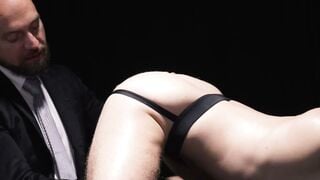 Adam Snow Deepthroats Bald Muscle Master's Hard Cock in Sissy Harness