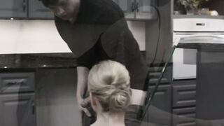Blonde Maid Cleaning Kitchen in Black Top with Man