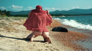 Tiffany walks nude on a sandy beach and fucks with BF