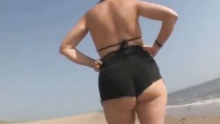 Step Mom Teases Huge Booty In Tight Black Bikini On Beach