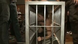 Christian Wilde Sucks Cock in Cage Rope Suspension Bar Gangbang