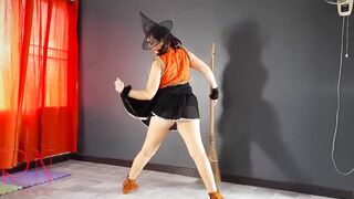 HALLOWEEN 2021 Witch inside a beauty red suit. Red-haired witch with pumpkins and a broom. Regina Noir