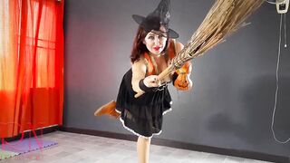 HALLOWEEN 2021 Witch inside a beauty red suit. Red-haired witch with pumpkins and a broom. Regina Noir