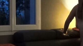 Mature Woman Defeated on Couch by Window for Neighbors to See