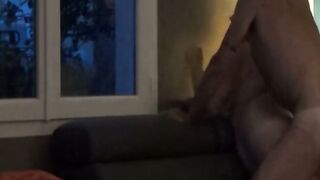 Mature Woman Defeated on Couch by Window for Neighbors to See