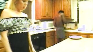 Delicious blonde gets african penetration on counter top