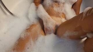 Big Boobed blonde eighteen masturbates into the hot tub