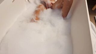 Big Boobed blonde eighteen masturbates into the hot tub