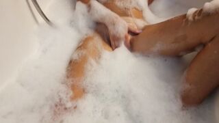 Big Boobed blonde eighteen masturbates into the hot tub