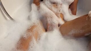 Big Boobed blonde eighteen masturbates into the hot tub