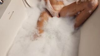 Big Boobed blonde eighteen masturbates into the hot tub