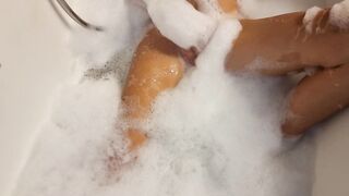 Big Boobed blonde eighteen masturbates into the hot tub