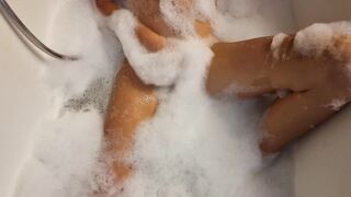 Big Boobed blonde eighteen masturbates into the hot tub