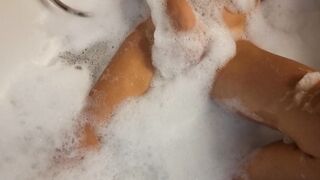 Big Boobed blonde eighteen masturbates into the hot tub