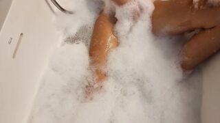 Big Boobed blonde eighteen masturbates into the hot tub