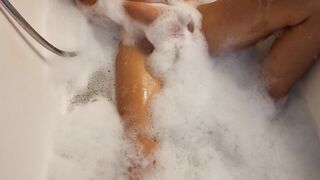 Big Boobed blonde eighteen masturbates into the hot tub