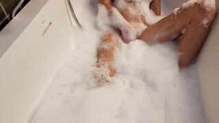 Big Boobed blonde eighteen masturbates into the hot tub