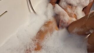 Big Boobed blonde eighteen masturbates into the hot tub