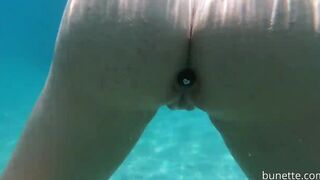 Booty Plug swim and piss on the beach