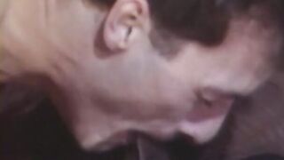 Ebony man shoves toy up white man's butt into retro three-way