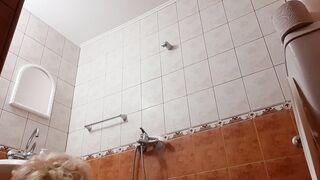 Shower with cloths and vibrator pounded into restroom