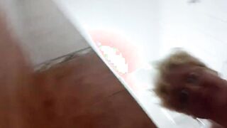 Shower with cloths and vibrator pounded into restroom