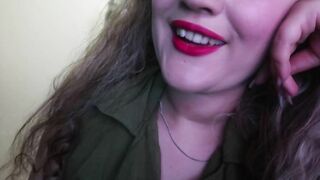 ADORABLE WOMAN PAINTS HER LIPS RED AND SMOKES a CIGARETTE
