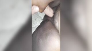 Black chubby chick having fun with her toy