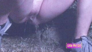 Peeing public inside a meadow at night