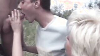 Hottie milf blows 2 dicks into the grass then they all boned