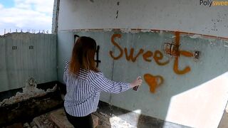 Draws graffiti, blows and fucks with a strap-on on an abandon