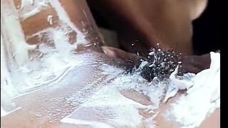 African stud shaves bushy twat of inked african ho